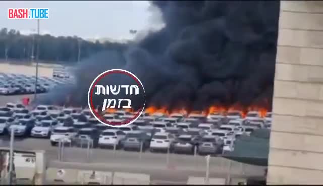  Горящая парковка на территории Израиля после прилёта ракеты